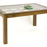 Dining table with glass top on an elegant lattice