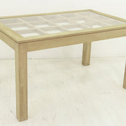 Dining table with glass top on an elegant lattice