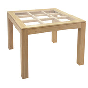 Squared dining table with glass top on an elegant lattice