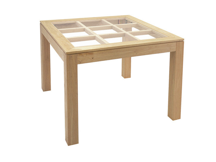 Squared dining table with glass top on an elegant lattice