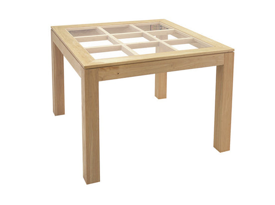 Squared dining table with glass top on an elegant lattice