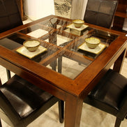 Squared dining table with glass top on an elegant lattice