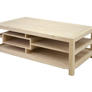 Coffee table with asymmetrical shelves